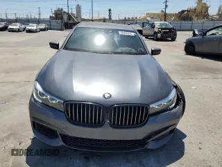 2018 BMW 7 Series 740i with VIN WBA7E2C59JG742809, listed as a Copart auction lot 66995934 with 62,017 mi miles and Salvage Title. Bid and sale history available at carsss.com. Image 5.