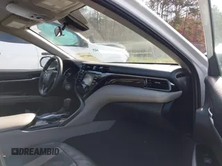 2020 Toyota Camry LE with VIN 4T1C11AKXLU986310, listed as a IAAI auction lot 40977100 with 108,208 mi miles and . Bid and sale history available at DreamBid. Image 5.