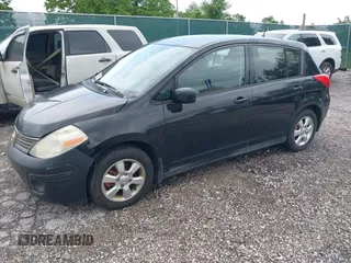 2009 Nissan Versa 1.8 S with VIN 3N1BC13E79L354341, listed as a IAAI auction lot 42079896 with 118,797 mi miles. Bid and sale history available at carsss.com. Image 2.