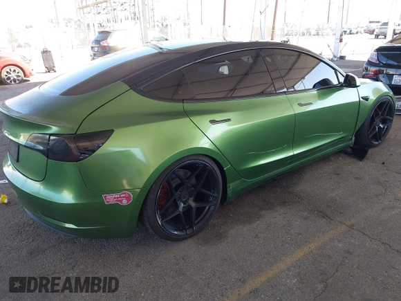 2020 Tesla Model 3 Standard Range Plus with VIN 5YJ3E1EA4LF799650, listed as a IAAI auction lot 41817538 with 54,835 mi miles. Bid and sale history available at carsss.com. Image 4.