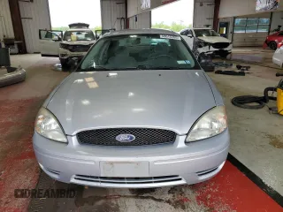 2005 Ford Taurus SE with VIN 1FAFP53215A133518, listed as a Copart auction lot 59615205 with 127,778 mi miles and Salvage title. Bid and sale history available at DreamBid. Image 5.