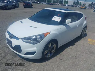 2015 Hyundai Veloster z VIN KMHTC6AD5FU231224, wystawiony jako IAAI lot #41944186 z przebiegiem 103 124 mil mil oraz . Historia ofert i sprzedaży dostępna na DreamBid. Obrazek 2.