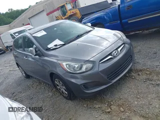 2014 Hyundai Accent GS with VIN KMHCT5AE3EU141605, listed as a IAAI auction lot 42157550 with 174,197 mi miles. Bid and sale history available at carsss.com. Image 1.