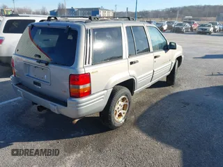 1997 Jeep Grand Cherokee Limited with VIN 1J4GZ78Y8VC718435, listed as a IAAI auction lot 41405361 with 210,599 mi miles. Bid and sale history available at carsss.com. Image 4.