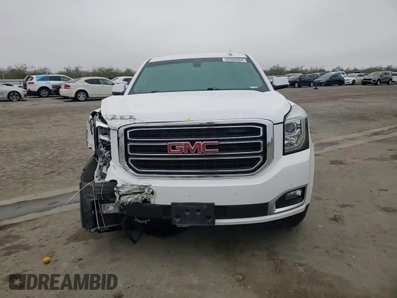 2015 GMC Yukon SLE with VIN 1GKS1AKC8FR733084, listed as a Copart auction lot 82960064 with 163,576 mi miles and Salvage Title. Bid and sale history available at carsss.com. Image 12.