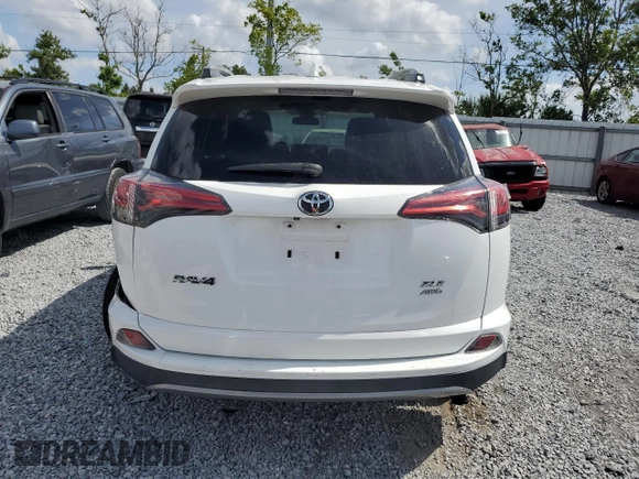 2018 Toyota RAV4 XLE with VIN 2T3RFREV1JW843426, listed as a Copart auction lot 52283125 with 12,809 mi miles and Salvage Title. Bid and sale history available at DreamBid. Image 6.