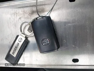 2022 Mazda 3 Select z VIN 3MZBPABL9NM316998, wystawiony jako IAAI lot #42117951 z przebiegiem 44 594 mil mil oraz . Historia ofert i sprzedaży dostępna na DreamBid. Obrazek 11.