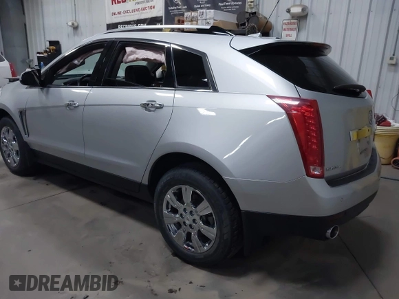 2014 Cadillac SRX Luxury Collection z VIN 3GYFNEE36ES679505, wystawiony jako IAAI lot #41817608 z przebiegiem 62 351 mil mil oraz . Historia ofert i sprzedaży dostępna na DreamBid. Obrazek 3.
