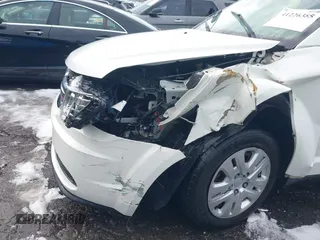 2018 Dodge Journey SE with VIN 3C4PDCAB1JT295988, listed as a IAAI auction lot 41226385 with 106,639 mi miles. Bid and sale history available at carsss.com. Image 6.