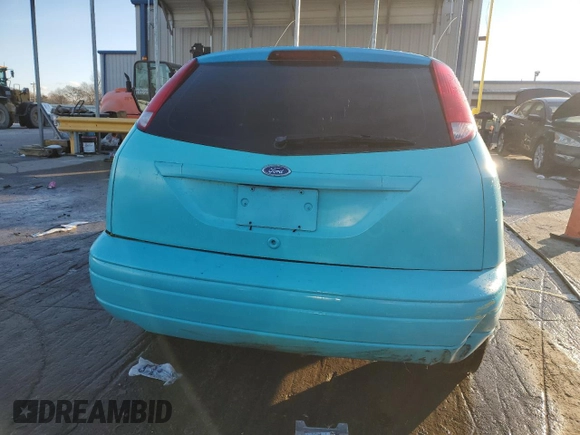 2000 Ford Focus ZX3 with VIN 3FAHP3131YR213601, listed as a Copart auction lot 88597525 with 134,724 mi miles and Salvage title. Bid and sale history available at DreamBid. Image 6.