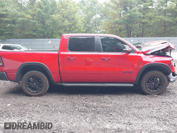 2021 Ram 1500 Rebel with VIN 1C6SRFLT2MN591844, listed as a IAAI auction lot 40410248 with 84,759 mi miles and . Bid and sale history available at DreamBid. Image 13.