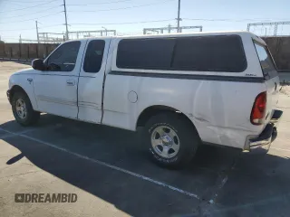 2000 Ford F-150 XL with VIN 1FTZX172XYNC01869, listed as a Copart auction lot 47414095 with 0 mi miles and Salvage Title. Bid and sale history available at carsss.com. Image 2.