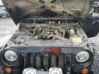 2009 Jeep Wrangler X with VIN 1J4FA241X9L735743, listed as a Copart auction lot 48109455 with 232,110 mi miles and Salvage Title. Bid and sale history available at DreamBid. Image 11.