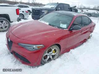 2021 Alfa Romeo Giulia Ti with VIN ZARFANBN5M7641290, listed as a IAAI auction lot 41593350 with 59,664 mi miles. Bid and sale history available at carsss.com. Image 2.