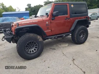 2014 Jeep Wrangler Rubicon with VIN 1C4BJWCG2EL303420, listed as a Copart auction lot 63550985 with 87,175 mi miles and Salvage title. Bid and sale history available at DreamBid. Image 1.