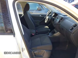 2012 Volkswagen Tiguan SE with VIN WVGAV7AX9CW590965, listed as a IAAI auction lot 41852407 with 153,953 mi miles and . Bid and sale history available at DreamBid. Image 5.
