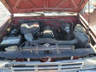 1991 Nissan Frontier XE with VIN 1N6SD11S2MC412375, listed as a Copart auction lot 61015515 with 201,629 mi miles and Salvage title. Bid and sale history available at DreamBid. Image 11.