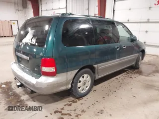 2003 Kia Sedona LX with VIN KNDUP131336390410, listed as a IAAI auction lot 41602426 with 170,613 mi miles. Bid and sale history available at carsss.com. Image 4.