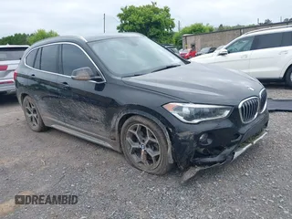 2017 BMW X1 xDrive28i with VIN WBXHT3Z34H4A57353, listed as a IAAI auction lot 42526506 with 66,811 mi miles and . Bid and sale history available at DreamBid. Image 1.