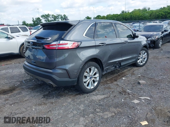 2021 Ford Edge Titanium z VIN 2FMPK3K9XMBA21766, wystawiony jako IAAI lot #42187940 z przebiegiem 79 732 mil mil oraz . Historia ofert i sprzedaży dostępna na DreamBid. Obrazek 4.