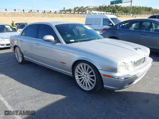 2004 Jaguar XJ with VIN SAJWA73B94TG30153, listed as a IAAI auction lot 41218841 with 91,158 mi miles. Bid and sale history available at carsss.com. Image 1.