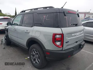2022 Ford Bronco Sport Badlands z VIN 3FMCR9D90NRD59108, wystawiony jako IAAI lot #42188624 z przebiegiem 36 965 mil mil oraz . Historia ofert i sprzedaży dostępna na DreamBid. Obrazek 3.