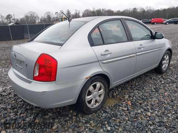2006 Hyundai Accent GLS with VIN KMHCN46C46U035208, listed as a IAAI auction lot 41769016 with 141,065 mi miles. Bid and sale history available at carsss.com. Image 4.