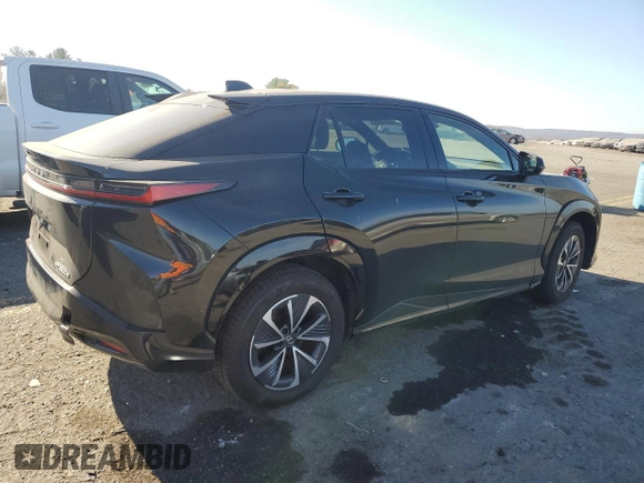 2024 Lexus RZ 300e Premium z VIN JTJABABBXRA001776, wystawiony jako Copart lot #76914814 z przebiegiem 1391 mil mil oraz Szkody całkowita. Historia ofert i sprzedaży dostępna na DreamBid. Obrazek 3.
