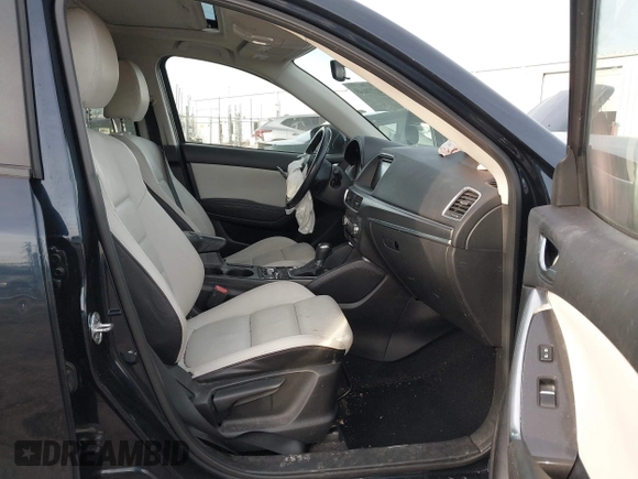 2016 Mazda CX-5 Grand Touring with VIN JM3KE4DY1G0823989, listed as a IAAI auction lot 41770149 with 40,677 mi miles. Bid and sale history available at carsss.com. Image 5.