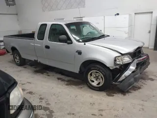 2002 Ford F-150 XL with VIN 1FTRX17W52NB23883, listed as a IAAI auction lot 41721680 with 144,115 mi miles. Bid and sale history available at carsss.com. Image 1.