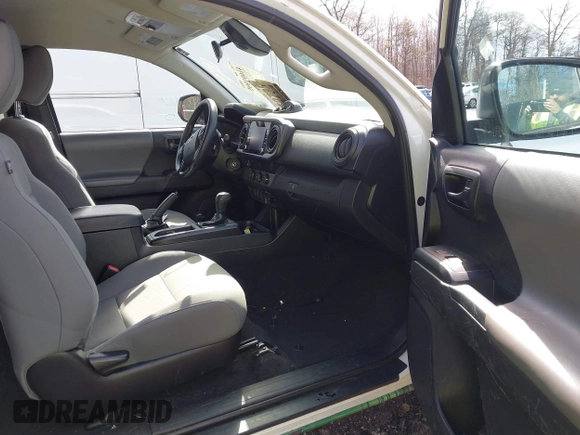 2021 Toyota Tacoma SR with VIN 3TYRX5GN6MT007673, listed as a IAAI auction lot 41691995 with 97,735 mi miles and . Bid and sale history available at DreamBid. Image 5.