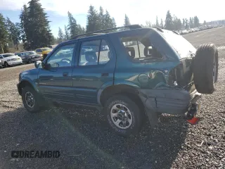 1999 Isuzu Rodeo S with VIN 4S2CM58W7X4359649, listed as a Copart auction lot 83450174 with 171,940 mi miles and Salvage title. Bid and sale history available at DreamBid. Image 2.