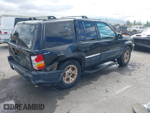 1996 Jeep Grand Cherokee Limited z VIN 1J4GZ78Y3TC191000, wystawiony jako IAAI lot #42259621 z przebiegiem 212 690 mil mil oraz . Historia ofert i sprzedaży dostępna na DreamBid. Obrazek 4.