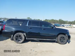 2018 Chevrolet Suburban LT with VIN 1GNSKHKCXJR268938, listed as a IAAI auction lot 41672886 with 76,844 mi miles and . Bid and sale history available at DreamBid. Image 13.