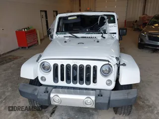 2015 Jeep Wrangler Sahara with VIN 1C4AJWBG7FL648621, listed as a IAAI auction lot 42439781 with 107,148 mi miles and . Bid and sale history available at DreamBid. Image 6.