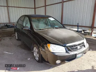 2005 Kia Spectra LX with VIN KNAFE121755201795, listed as a IAAI auction lot 41567654 with 68,855 mi miles. Bid and sale history available at carsss.com. Image 1.