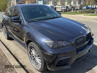 2011 BMW X6 M with VIN 5YMGZ0C55BLK14213, listed as a Copart auction lot 52201175 with 117,851 mi miles and Clean Title. Bid and sale history available at carsss.com. Image 1.