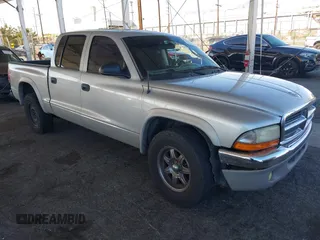 2003 Dodge Dakota SLT with VIN 1D7HL48N13S294573, listed as a IAAI auction lot 41291127 with 227,355 mi miles. Bid and sale history available at carsss.com. Image 1.