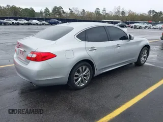 2013 Infiniti M with VIN JN1BY1AP4DM513899, listed as a IAAI auction lot 41854573 with 202,480 mi miles and . Bid and sale history available at carsss.com. Image 4.