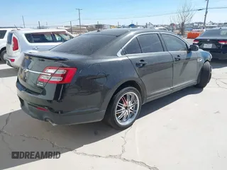 2014 Ford Taurus SEL with VIN 1FAHP2E83EG184976, listed as a IAAI auction lot 41590153 with 177,342 mi miles. Bid and sale history available at carsss.com. Image 4.
