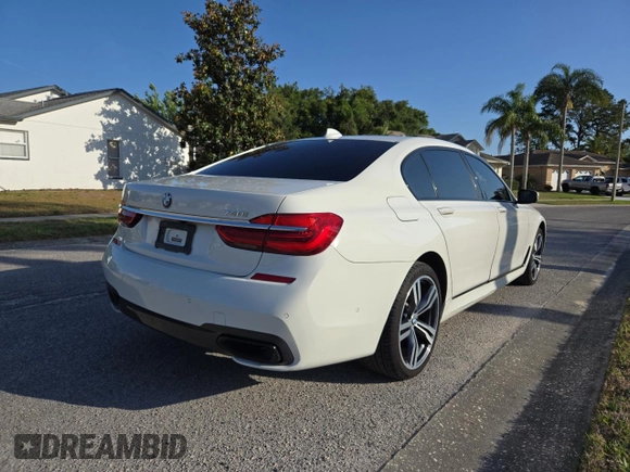 2017 BMW 7 Series 740i with VIN WBA7E2C54HG740427, listed as a Copart auction lot 54992345 with 93,252 mi miles and Clean Title. Bid and sale history available at carsss.com. Image 4.