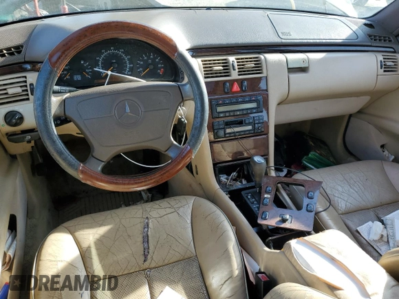 1997 Mercedes-Benz E-Class with VIN WDBJF55F5VJ028552, listed as a Copart auction lot 84172054 with 308,426 mi miles and Clean Title. Bid and sale history available at carsss.com. Image 8.