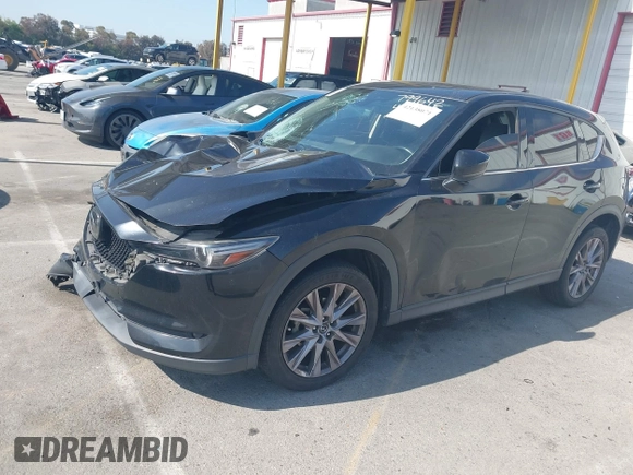 2019 Mazda CX-5 Grand Touring with VIN JM3KFADMXK1547727, listed as a IAAI auction lot 42138071 with Not provided miles and . Bid and sale history available at DreamBid. Image 2.