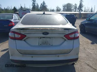 2016 Ford Fusion Titanium Hybrid with VIN 3FA6P0RU2GR357739, listed as a IAAI auction lot 42120441 with 151,201 mi miles. Bid and sale history available at carsss.com. Image 16.