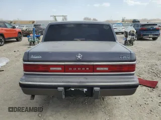 1993 Dodge Dynasty z VIN 1B3XC4638PD195963, wystawiony jako Copart lot #49120625 z przebiegiem 86 825 mil mil oraz Szkoda całkowita • Salvage title. Historia ofert i sprzedaży dostępna na DreamBid. Obrazek 6.