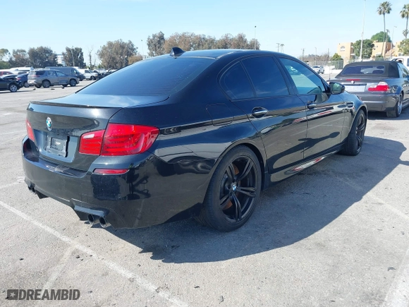 2013 BMW M5 with VIN WBSFV9C54DC772568, listed as a IAAI auction lot 41866486 with 99,072 mi miles. Bid and sale history available at carsss.com. Image 4.