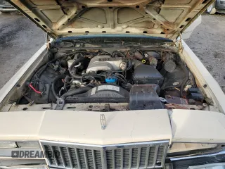 1987 Mercury Grand Marquis GS z VIN 2MEBM74F9HX714211, wystawiony jako Copart lot #43594205 z przebiegiem 26 933 mil mil oraz Szkody całkowita. Historia ofert i sprzedaży dostępna na DreamBid. Obrazek 11.