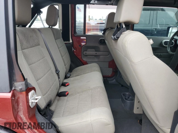 2007 Jeep Wrangler Unlimited Sahara z VIN 1J4GB59157L199454, wystawiony jako Copart lot #82314724 z przebiegiem Nie podano mil oraz Czysty tytuł • Clean title. Historia ofert i sprzedaży dostępna na DreamBid. Obrazek 10.