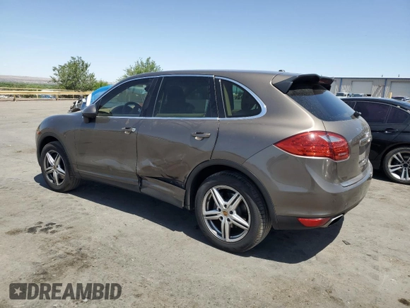 2014 Porsche Cayenne z VIN WP1AA2A28ELA91097, wystawiony jako Copart lot #57812585 z przebiegiem 115 596 mil mil oraz Szkoda całkowita • Salvage title. Historia ofert i sprzedaży dostępna na DreamBid. Obrazek 2.