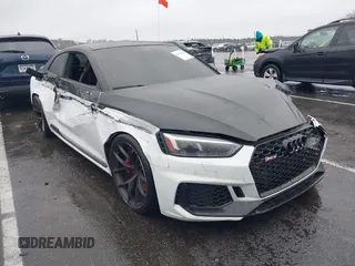 2018 Audi RS 5 z VIN WUAPWAF5XJA905043, wystawiony jako IAAI lot #41978868 z przebiegiem 60 838 mil mil oraz . Historia ofert i sprzedaży dostępna na DreamBid. Obrazek 1.